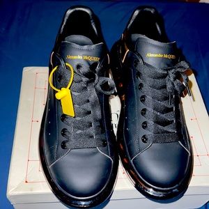Black/Gold Alexander McQueen Size 43.5/ 10.5. Upper: calfskin. Sole: rubber.